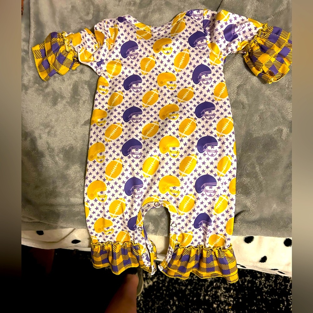 Jumper yellow and purple with ruffles on the bottom of legs and arms